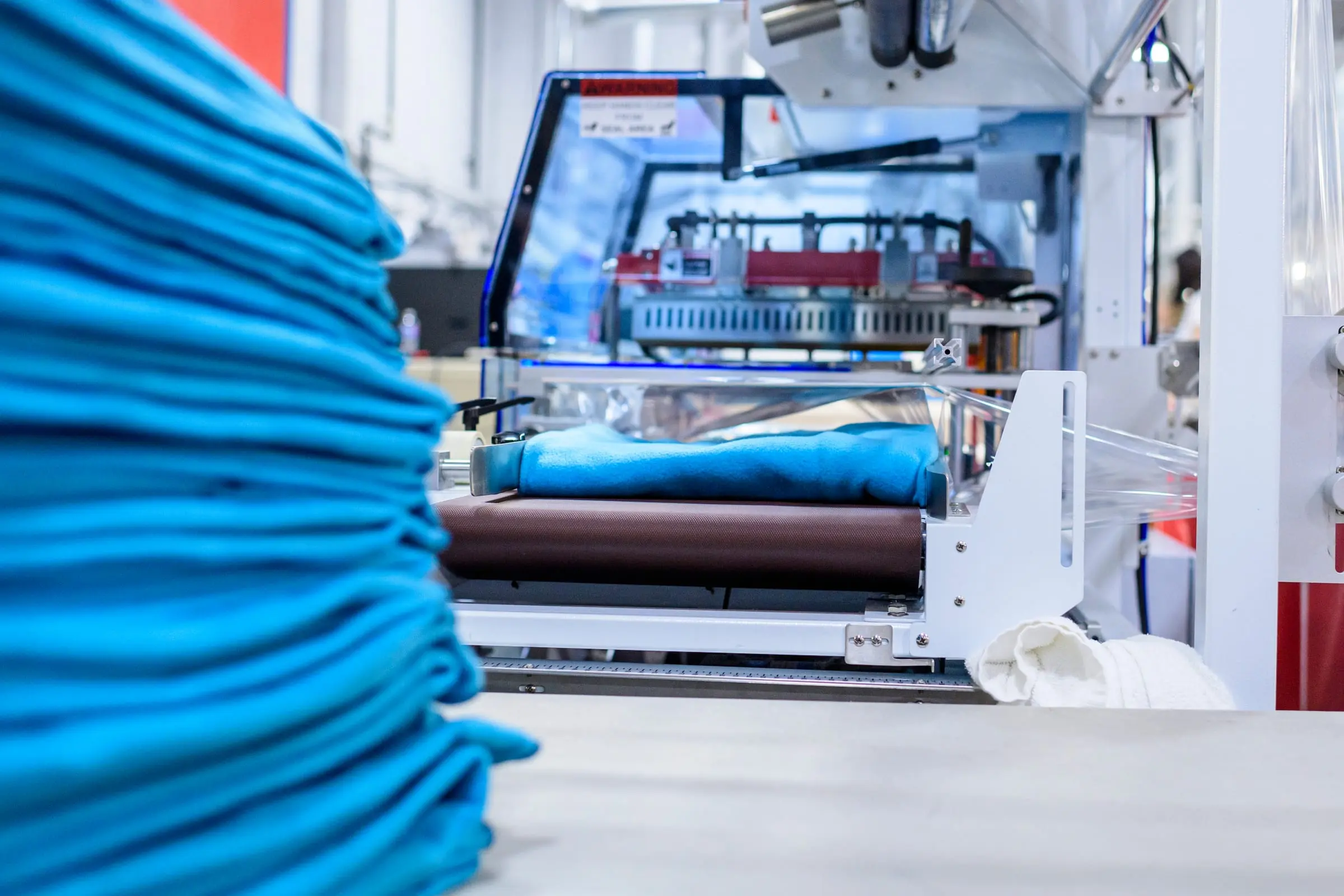 Neatly stacked, sealed commercial linens ready for delivery